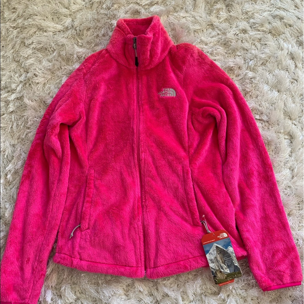 Pink North Face fuzzy jacket.